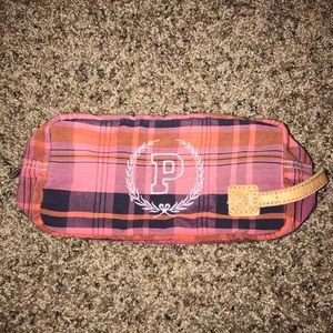 Pink brand toiletry case.